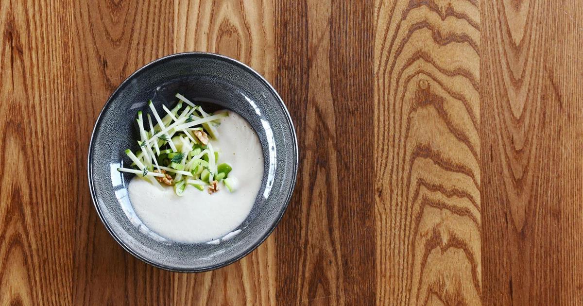 Apple soup with apple pearls, celery and walnuts